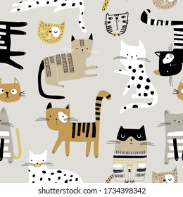 Seamless childish pattern with hand drawn cats in different poses. Creative kids hand drawn texture for fabric, wrapping, textile, wallpaper, apparel. Vector illustration