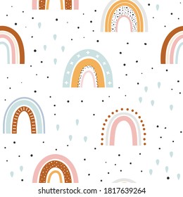 Seamless childish pattern with hand drawn rainbows. Scandi nursery background. Trendy baby texture for fabric textile wallpaper apparel wrapping.