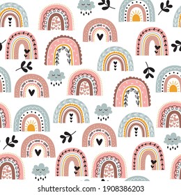 Seamless childish pattern with hand drawn rainbows, clouds and leaves. Scandi nursery background. Trendy baby texture for fabric, textile, wallpaper, apparel or wrapping.