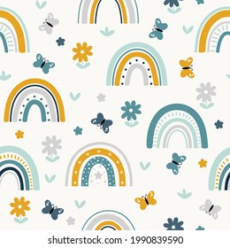 Seamless childish pattern with hand drawn rainbows butterflies and flowers. Scandi nursery background. Trendy baby texture for fabric textile wallpaper apparel wrapping.