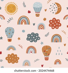 Seamless childish pattern with hand drawn rainbows, clouds and hot air balloons. Scandinavian style pattern. Vector illustration