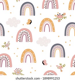 Seamless childish pattern with rainbows and flowers in pastel color. Scandi kids background. Trendy baby texture for fabric textile wallpaper apparel wrapping.