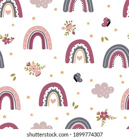 Seamless childish pattern with rainbows and flowers, butterflies and clouds. Scandi childish background. Trendy baby texture for fabric textile wallpaper apparel wrapping.