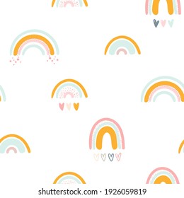 Seamless childish pattern with rainbows and hearts. Seamless pattern for fabric, paper, wrapping and other