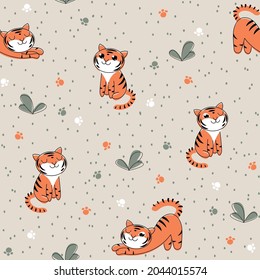 Nahtlose Kindermuster mit einem Tigerwürfel auf dem Gras. Vektorgrauer Hintergrund mit sich wiederholendem Baby, Punkten und Blättern. Neujahrsverpackung mit dem Symbol des Jahres.