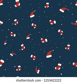 Seamless christmas background with hand drawn socks and hats. Decorative pattern for print, card, wrapping paper, packaging, poster, paper.