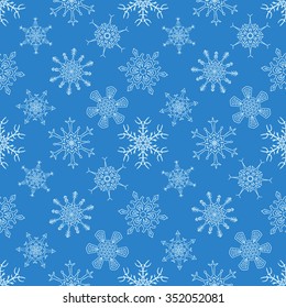 Seamless Christmas blue pattern with random drawn snowflakes