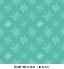 Seamless Christmas green pattern with random drawn snowflakes