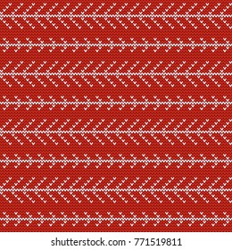 Seamless Christmas nordic knitting vector pattern with white branch of fir-tree on red background