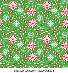 Seamless Christmas Pattern with Candy Canes, Lollipop and Snowflakes on Green Background, Christmas candy canes, winter holidays print for textile, wallpaper, wrapping paper and fabric.