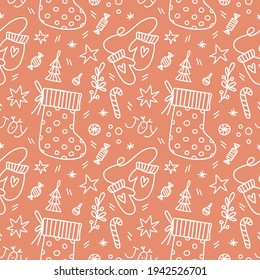 Seamless christmas pattern with candy, mittens, christmas sock, star, mistletoe on terracotta background