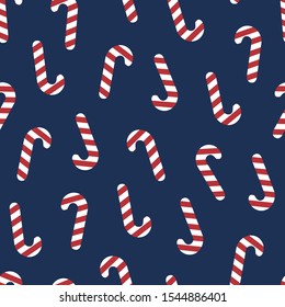 Seamless christmas pattern with caramel cane on a blue background. Cute vector illustration Poster for your business design.
