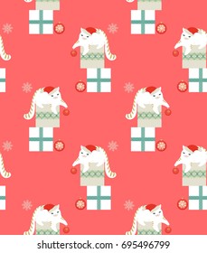 Seamless christmas pattern with cats, baubles, snowflakes and gift boxes on salmon-pink background