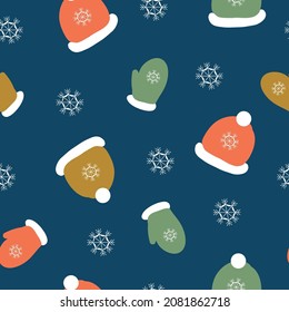 seamless Christmas pattern. Colored hats and mittens, snow. Dark blue background . vector texture. trendy print for textiles, wallpaper and packaging.