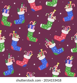 Seamless Christmas pattern. Colorful colored socks with gifts and sweet candy. Home decoration, place for New Year presents. vector design template.