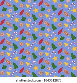 seamless christmas pattern consisting of gingerbread cookies, striped sweets and christmas tree toys on a blue background