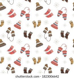 Seamless Christmas pattern with cozy and warm socks, hats and mittens