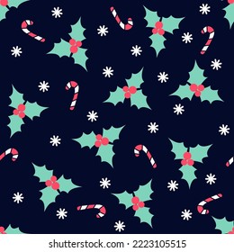 Seamless Christmas pattern in flat style with holly berry, candy cane and snowflakes on dark blue background.