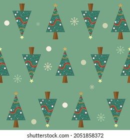 Patrón de navidad sin foco. Fondo Verde con copos de nieve y árboles de navidad. Papel pintado decorativo, bueno para imprimir. 