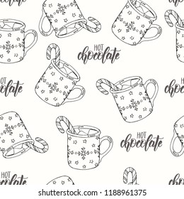 Seamless Christmas pattern with hand drawn doodle cup of hot chocolate with marshmallow and candy. lettering phrase "hot chocolate". Can be used for wallpaper, web page background, surface textures.