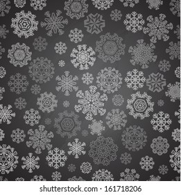Patrón de Navidad sin problemas con copos de nieve monocromos en pizarra