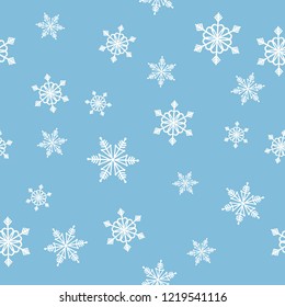 Seamless Christmas Pattern on a blue background with snowflakes