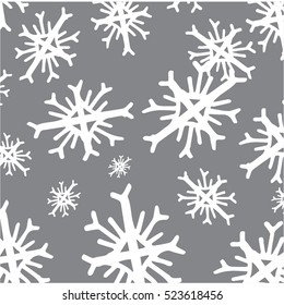 seamless Christmas pattern. Christmas ornament. pattern with white snowflakes on a silver or gray background. 
