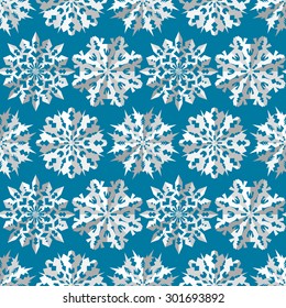 Seamless christmas pattern. Paper snowflake origami white icon silhouettes on blue background. Paper cut out convex sign with shadow. Winter theme texture. Vector illustration.