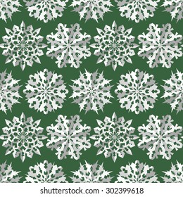Seamless christmas pattern. Paper snowflake origami white icon silhouettes on dark green background. Paper cut out convex sign with shadow. Winter theme texture. Vector illustration.