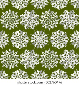Seamless christmas pattern. Paper snowflake origami white icon silhouettes on green/olive background. Paper cut out convex sign with shadow. Winter theme texture. Vector illustration.