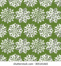 Seamless christmas pattern. Paper snowflake origami white icon silhouettes on green background. Paper cut out convex sign with shadow. Winter theme texture. Vector illustration.