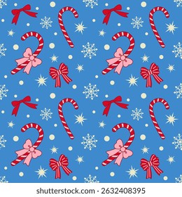 Seamless Christmas pattern with red bows and candy canes on blue background. Season greetings wallpaper.