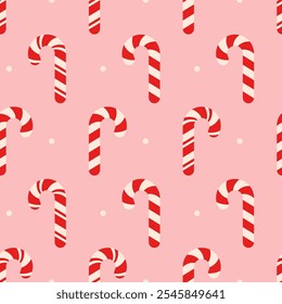 Seamless Christmas pattern with red and white candy cane on pink background.