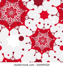 Seamless Christmas pattern. Red and white snowflakes on a gray background. A blank for printing on fabric, wrapping paper, textiles. The background screen for Christmas.