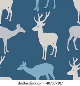 Seamless christmas pattern with reindeer. Blue Background with deers.Vector illustration.
