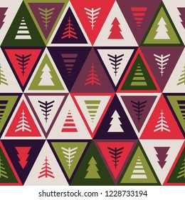 Seamless Christmas pattern in retro style. Geometric ornament with Christmas trees. Scandinavian texture. Triangle background. Vector background for fabric, wallpaper, 