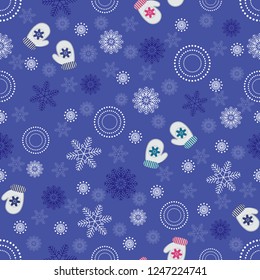 Seamless Christmas pattern with a pattern of snowflakes and mittens.
