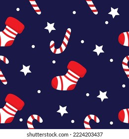 Seamless Christmas pattern with socks, stars and lollipops.Vector design for winter holidays. Happy New Year and Merry Christmas background.