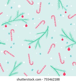 Seamless christmas pattern with striped candies and decorated conifer branches