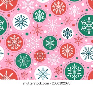 Seamless Christmas Snowflake pattern. Red, green, pink ornaments background