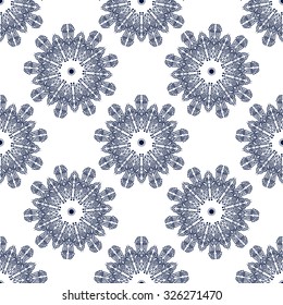 Seamless circular pattern of winter snowflakes. Ornamental texture, winter flowers. The structure of the complex shapes of snow. 