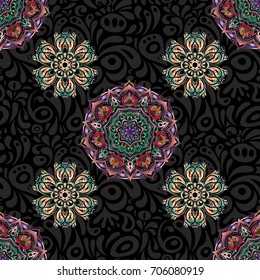 Seamless classic vector pattern. Traditional orient ornament. Classic vintage ornament in pink and red colors on a black background.