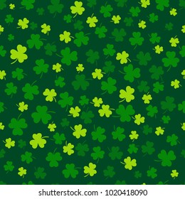 Seamless clover leaf flat design green pattern falling on dark green background vector illustration