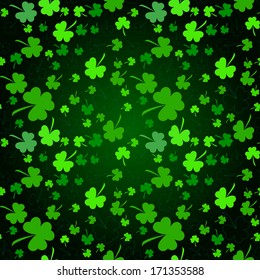 Seamless clover pattern on dark background at Patrick's Day