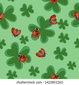 Seamless clover texture with ladybugs. Vector pattern.