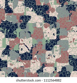 A seamless color pattern composed of torn spots. Texture in camouflage style. Fashionable wallpaper. Interlacing of many rounded elements.