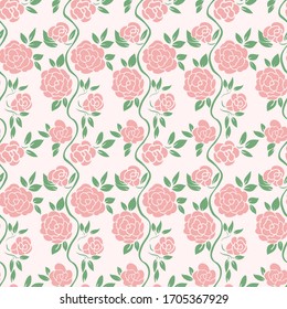 Seamless colored background of pink roses with green leaves.