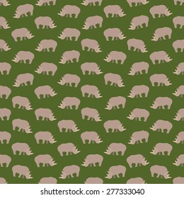 Seamless colorful background made of  rhinos in flat design