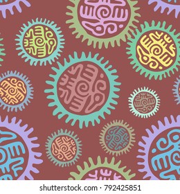 Seamless colorful fashion backdrop pattern with aztec and mayan eagle and a sun-shaped circle on brown background