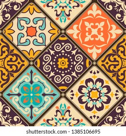 Seamless colorful patchwork tile with Islam, Arabic, Indian, Ottoman motifs. Majolica pottery tile. Portuguese and Spain decor. Azulejo. Ceramic tile in talavera style. Boho pattern